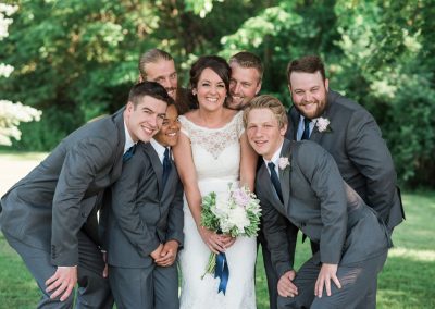 Professional wedding photography bride with groomsmen