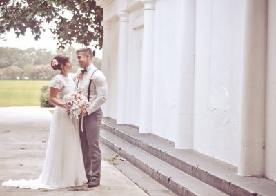 bride and groom embracing outside church