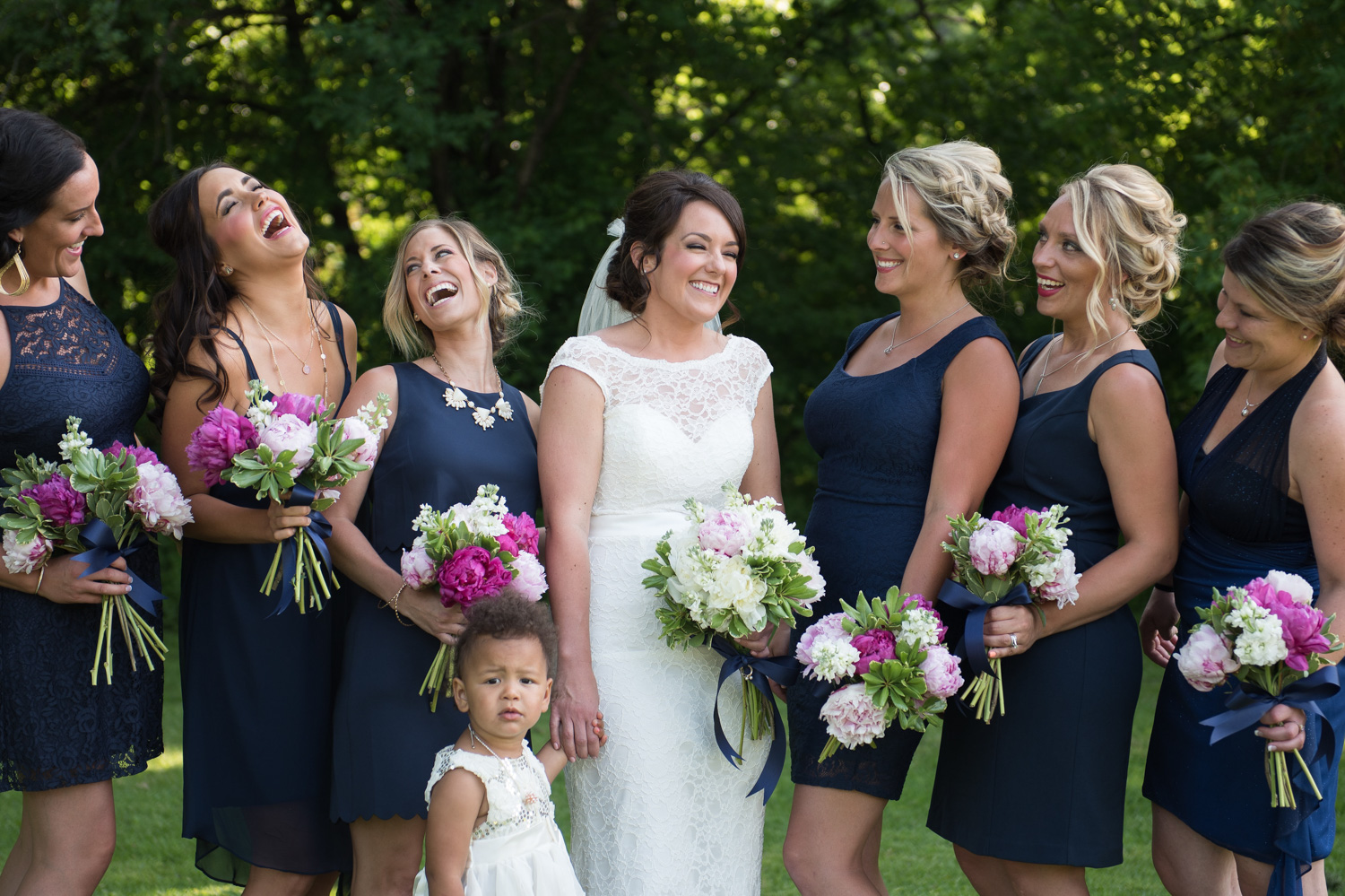 bride surrounded by bridesmaids